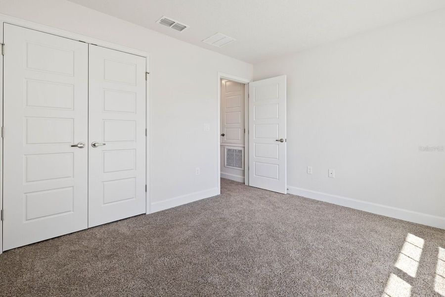 Representative unfurnished interior of a home built from the 1755 by Adams Homes in Okeechobee, Okeechobee (Image 9).