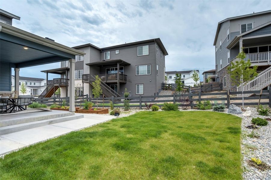 Front exterior of a new home in , Castle Pines, CO, highlighting curb appeal (Image 1). Front exterior of a new home in , Castle Pines, CO, highlighting curb appeal (Image 1).