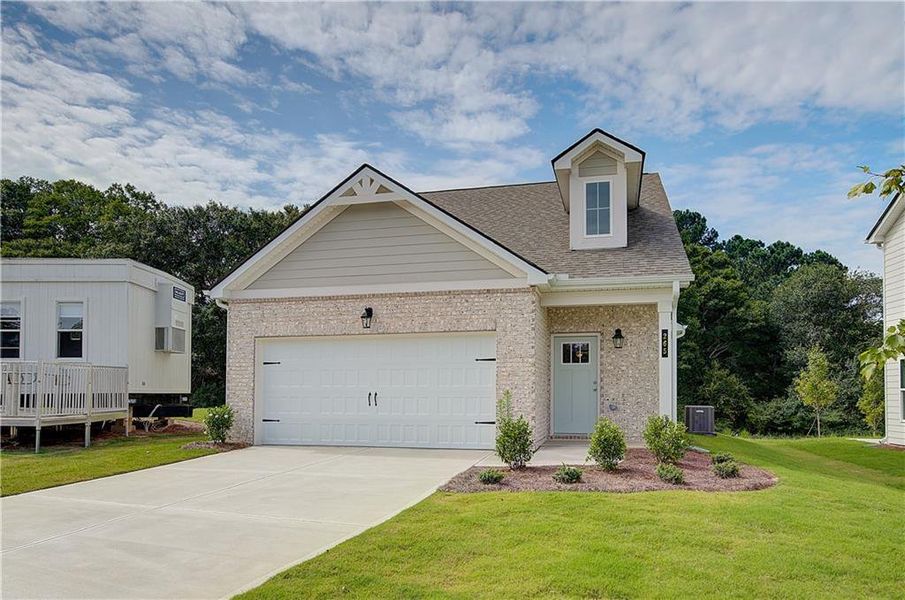 Front exterior of a new home in Abbotts Crossing, Conyers, GA, highlighting curb appeal (Image 2). Front exterior of a new home in Abbotts Crossing, Conyers, GA, highlighting curb appeal (Image 2).