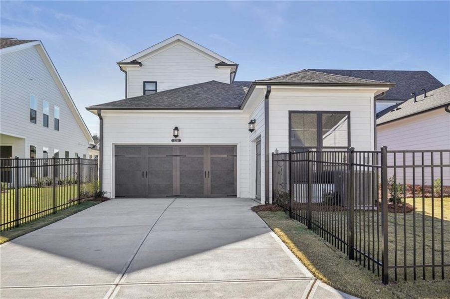 Front exterior of a new home in Promenade at Sawnee Village, Cumming, GA, highlighting curb appeal (Image 23).