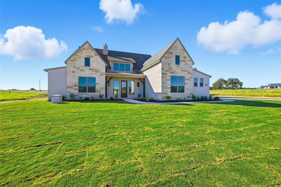 Front exterior of a new home in , Poolville, TX, highlighting curb appeal (Image 1). Front exterior of a new home in , Poolville, TX, highlighting curb appeal (Image 1).