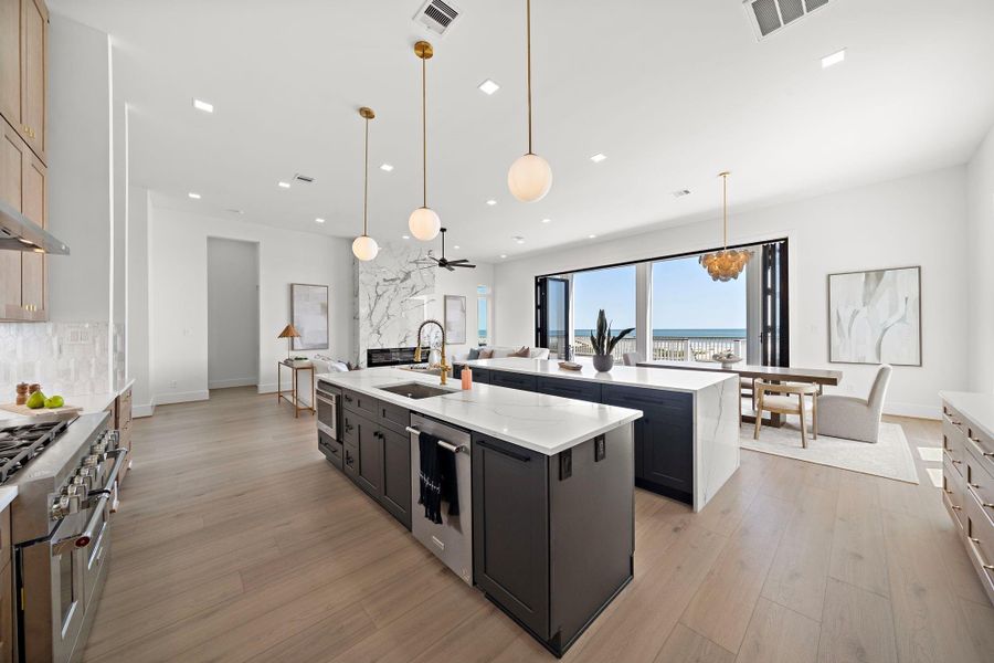 This kitchen is a chef's dream with its 48 inch Gas Stove and double islands. This kitchen is a chef's dream with its 48 inch Gas Stove and double islands.