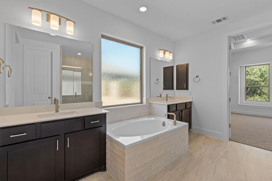 Primary Bath retreat with dual vanities & garden tub