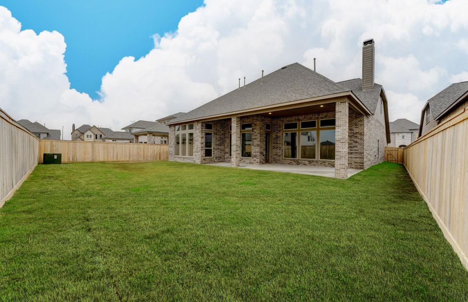 Exterior details and patio area of a home in The Woodlands Hills 65′, Willis (Image 3).