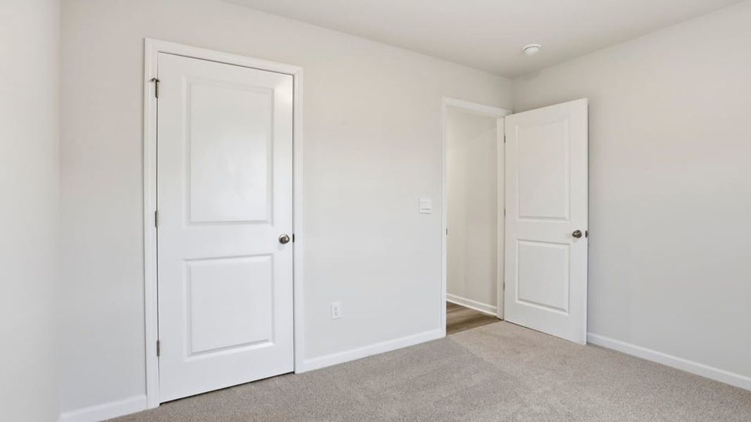 Spacious, unfurnished interior of a new home in Bentley Park, Greenwood (Image 14).