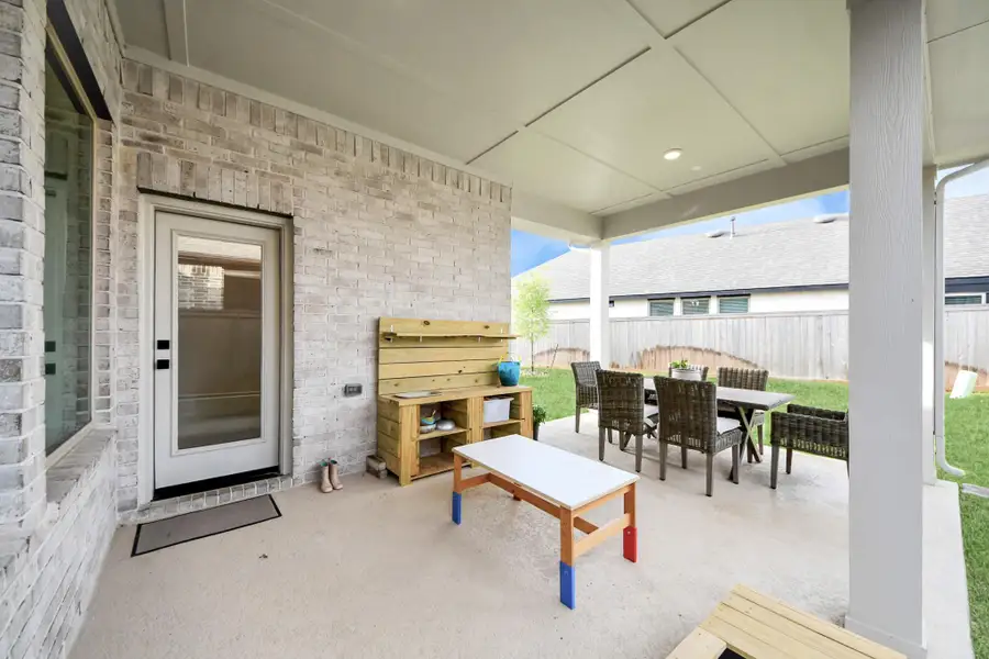 Backyard with a covered porch.