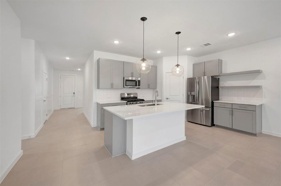 Stylish kitchen with light grey cabinets and floating shelves