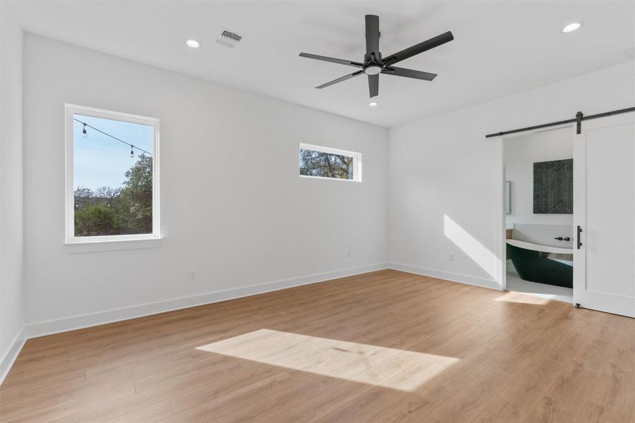 Spacious primary bedroom with abundant natural light, clean modern lines, and a calm, private retreat feel. Spacious primary bedroom with abundant natural light, clean modern lines, and a calm, private retreat feel.