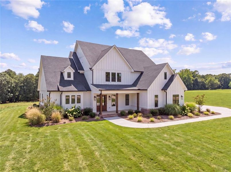 Front exterior of a new home in , Loganville, GA, highlighting curb appeal (Image 26).