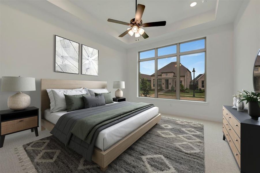 Spacious room featuring a tray ceiling, recessed lighting, and a multi-pane window