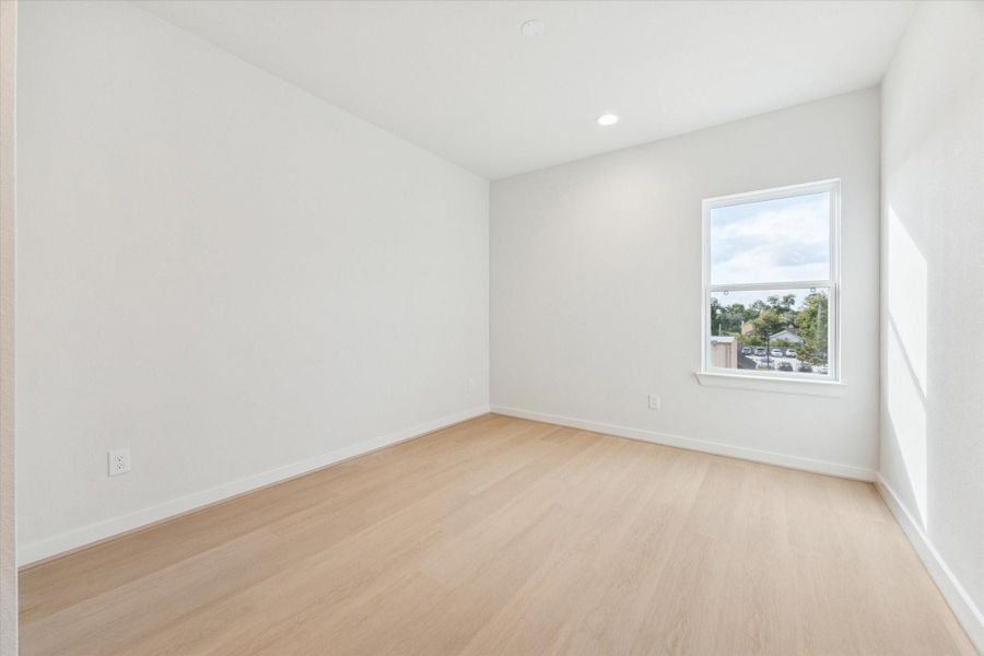 Spacious third-floor game room with abundant natural light and flexible layout, perfect for entertaining, play, or a media retreat.