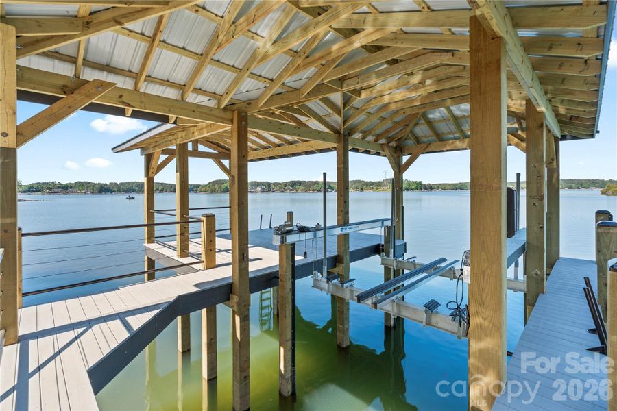 New covered dock features a power lift and seating area