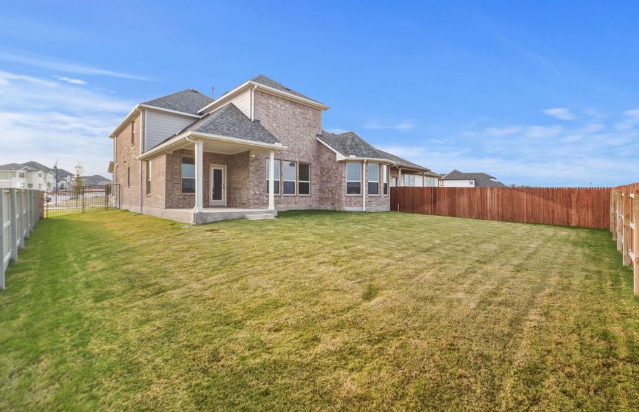 Exterior details and patio area of a home in Saddleback at Santa Rita Ranch, Liberty Hill (Image 4). Exterior details and patio area of a home in Saddleback at Santa Rita Ranch, Liberty Hill (Image 4).