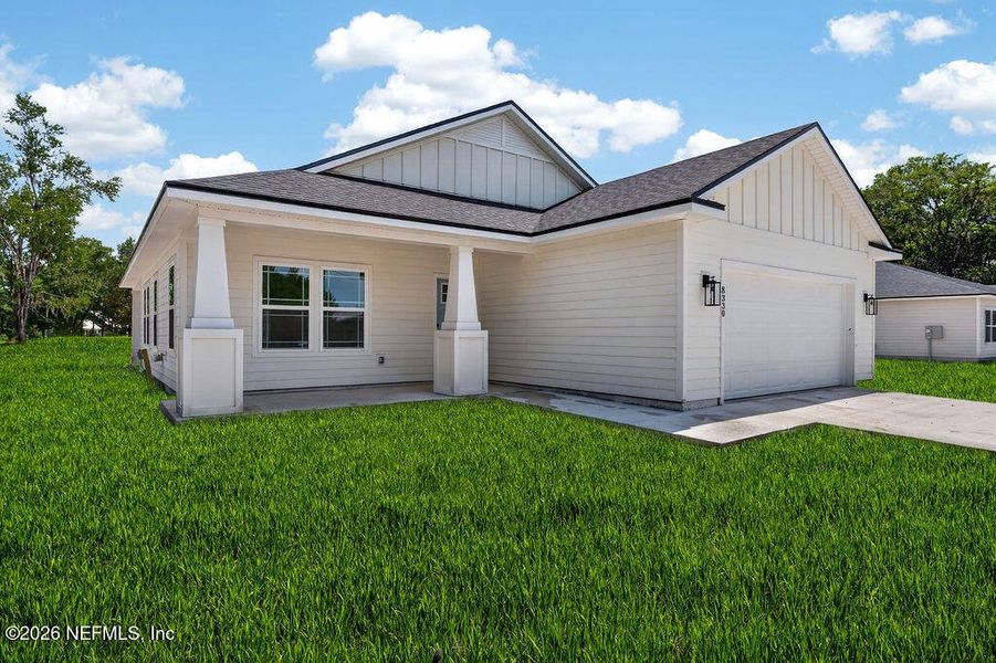 Front exterior of a new home in , Middleburg, FL, highlighting curb appeal (Image 2). Front exterior of a new home in , Middleburg, FL, highlighting curb appeal (Image 2).