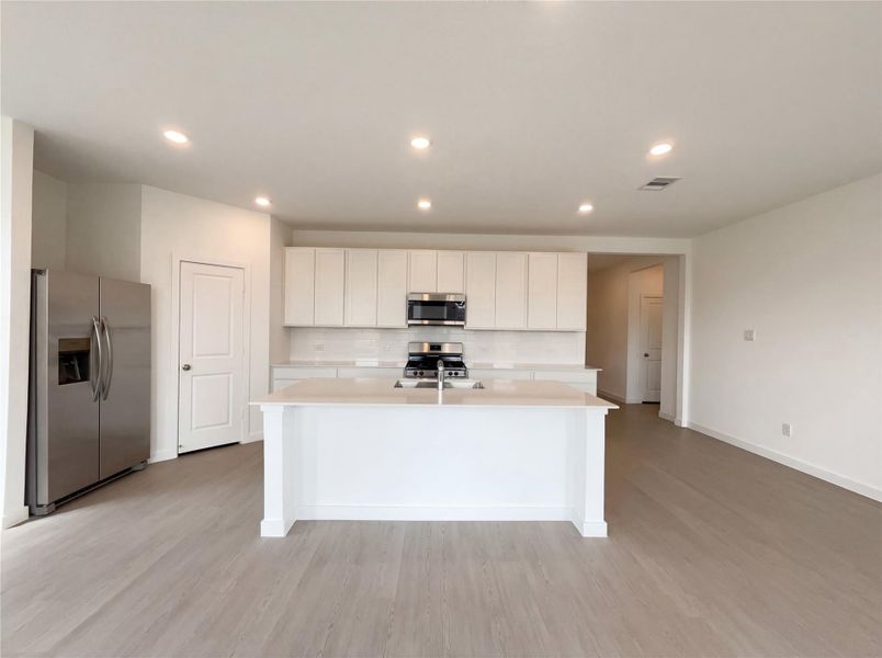 Furnished interior view inside a new home in Sunterra, Katy (Image 11).