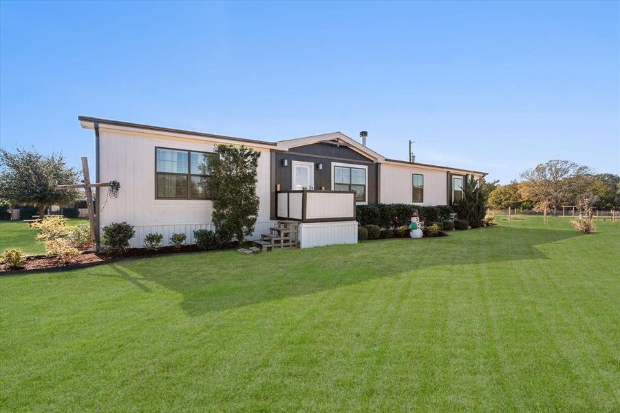 Home with a front yard Home with a front yard