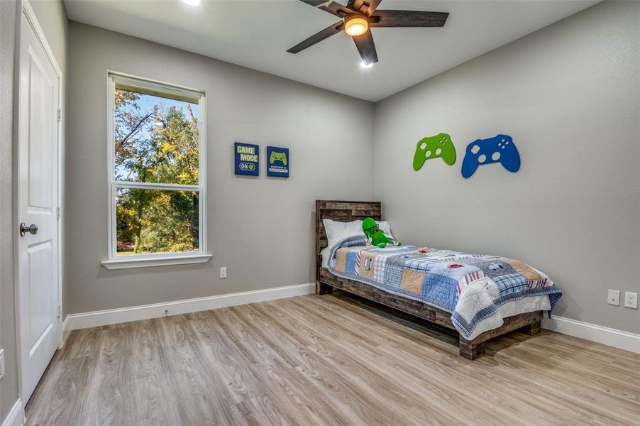 Bedroom featuring light wood-type flooring and ceiling fan