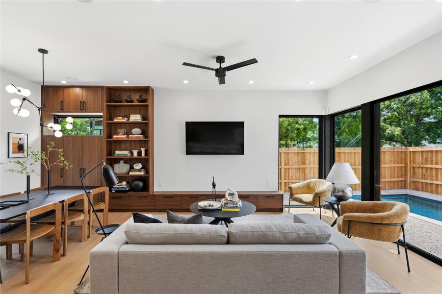 Natural light floods this inviting living space, connecting seamlessly with the private outdoor oasis.