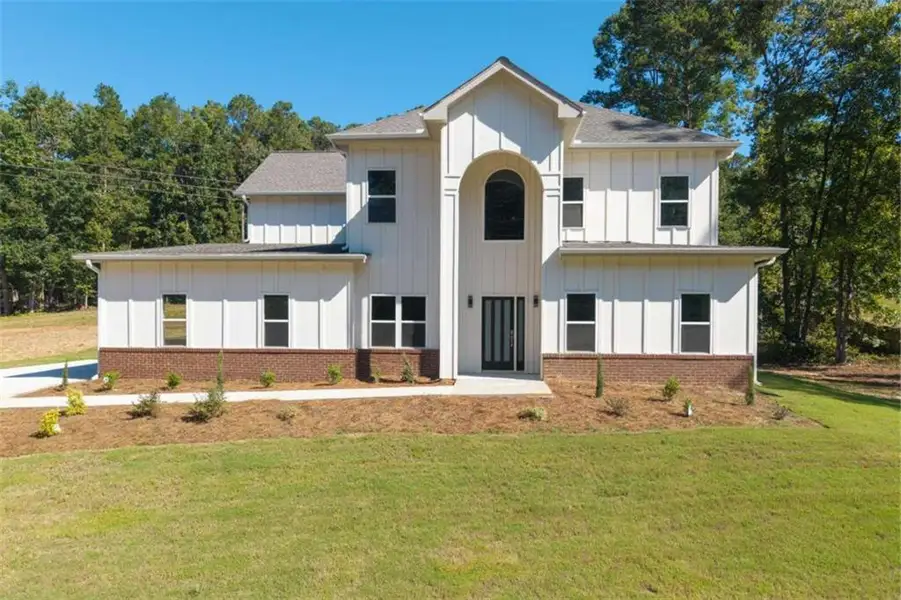 Front exterior of a new home in , Snellville, GA, highlighting curb appeal (Image 19).