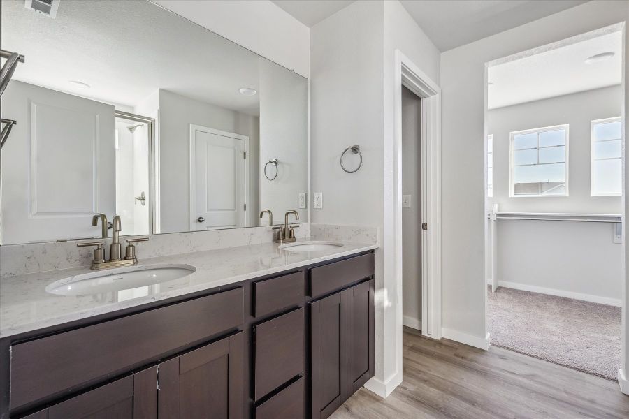 A bathroom with a large mirror. A bathroom with a large mirror.