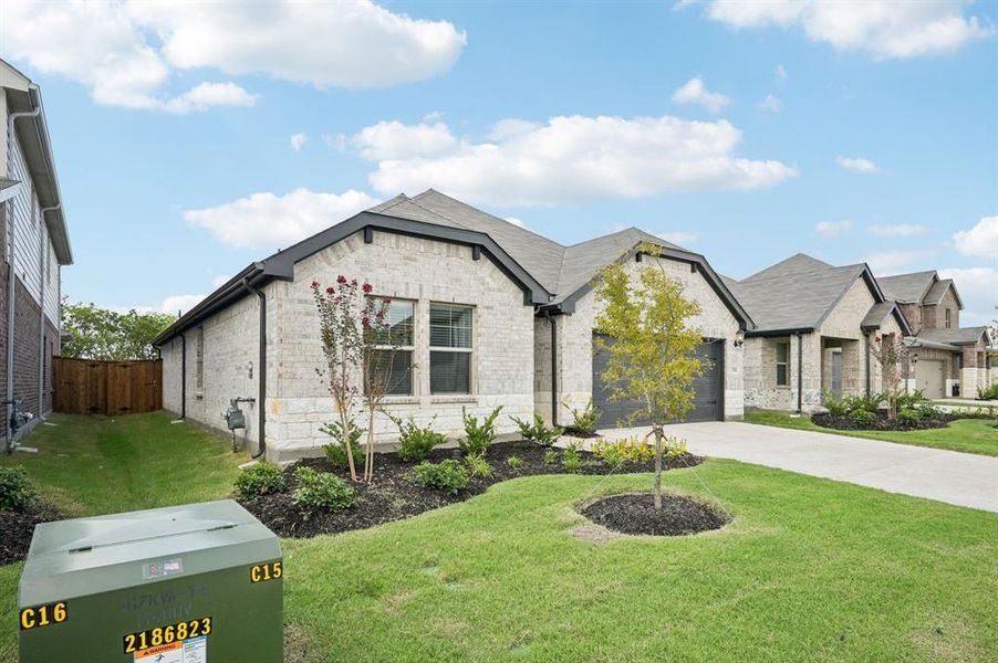 Front exterior of a new home in Lakehaven - Signature Series, Farmersville, TX, highlighting curb appeal (Image 20). Front exterior of a new home in Lakehaven - Signature Series, Farmersville, TX, highlighting curb appeal (Image 20).