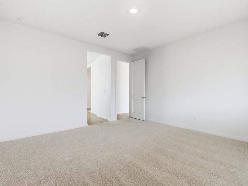 Spacious, unfurnished interior of a new home in Blossom Rock Reserve Series, Apache Junction (Image 15).