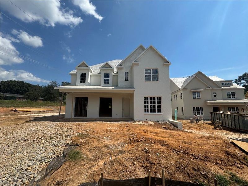 Front exterior of a new home in , Suwanee, GA, highlighting curb appeal (Image 1). Front exterior of a new home in , Suwanee, GA, highlighting curb appeal (Image 1).