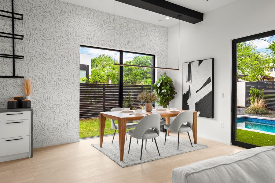 Dining space with light wood-style floors, beam ceiling, and recessed lighting