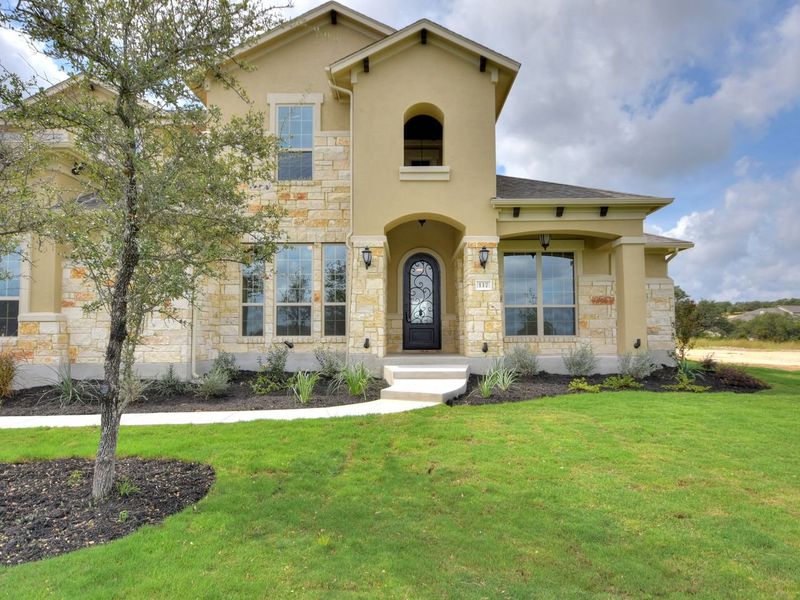 Representative exterior photo of a completed home built from the Madera II by Giddens Homes in Scofield Farms Estates, Georgetown, TX (Image 48).