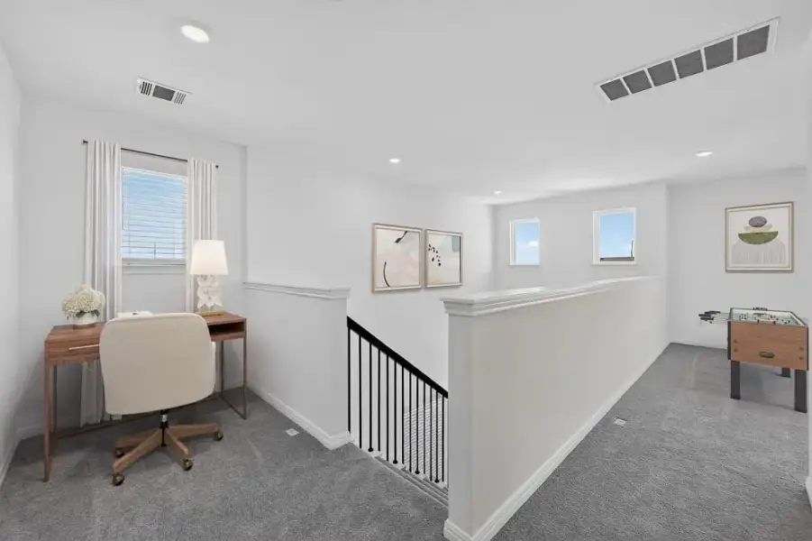 Representative furnished interior of a home built from the Merlin by Taylor Morrison in Sunfield, Mustang Ridge (Image 11).