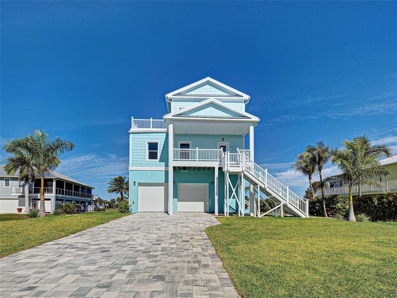 Front exterior of a new home in , Placida, FL, highlighting curb appeal (Image 29). Front exterior of a new home in , Placida, FL, highlighting curb appeal (Image 29).