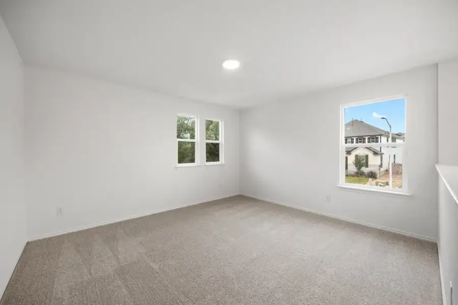 Spacious, unfurnished interior of a new home in River Bluff, Leander (Image 21).
