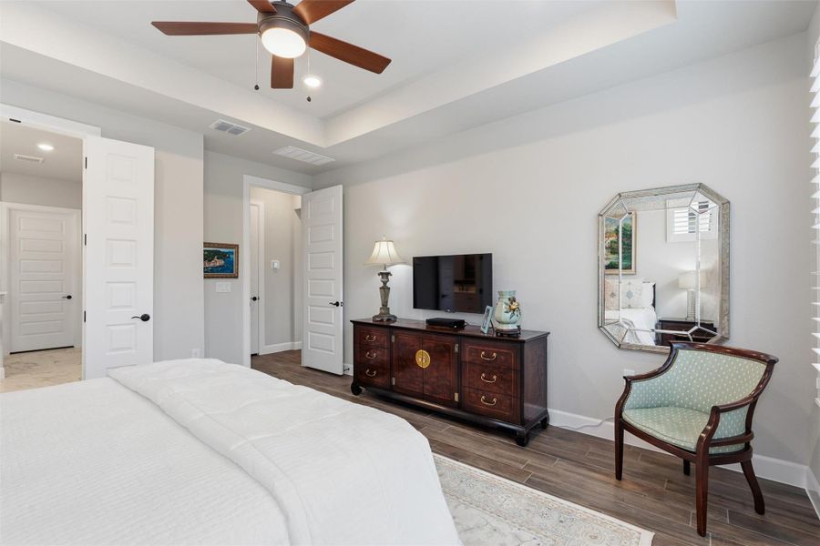 French doors leading to the primary bath and other door leads to the kitchen, dining and family rooms. French doors leading to the primary bath and other door leads to the kitchen, dining and family rooms.