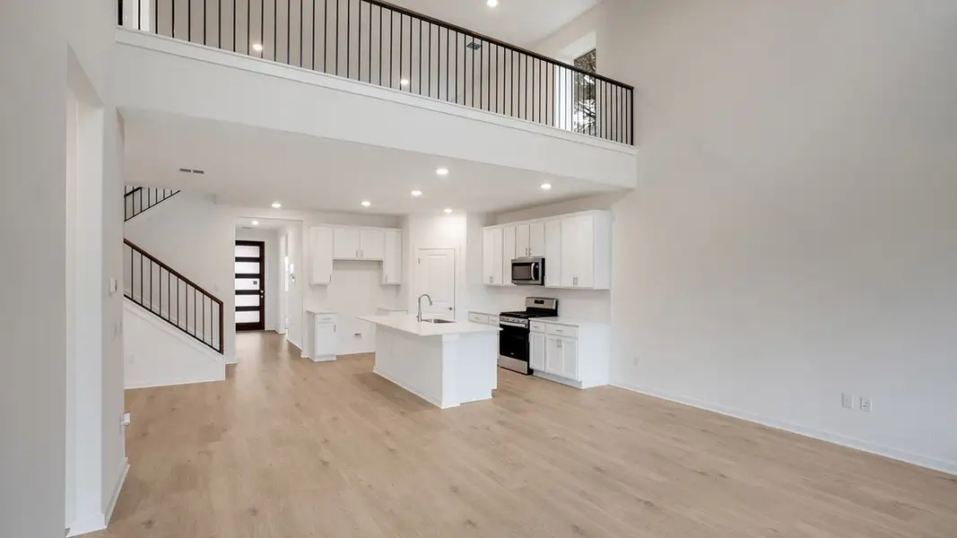Furnished interior view inside a new home in Prairie Oaks, Oak Point (Image 3).