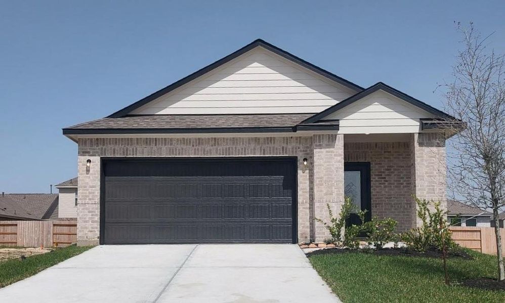 Front exterior of a new home in Windrose Green, Angleton, TX, highlighting curb appeal (Image 2). Front exterior of a new home in Windrose Green, Angleton, TX, highlighting curb appeal (Image 2).
