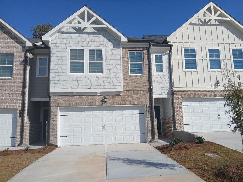 Front exterior of a new home in Union Village, McDonough, GA, highlighting curb appeal (Image 1). Front exterior of a new home in Union Village, McDonough, GA, highlighting curb appeal (Image 1).