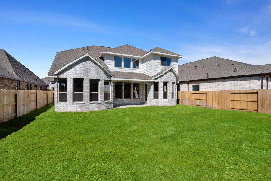 Exterior details and patio area of a home in The Trails, New Caney (Image 4).