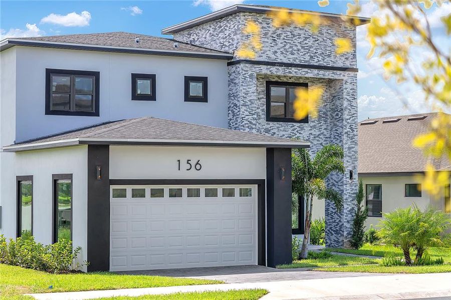 Front exterior of a new home in , Lake Alfred, FL, highlighting curb appeal (Image 22).