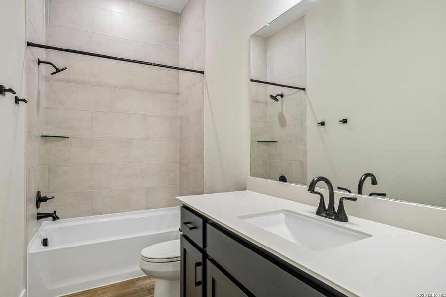 Furnished interior view inside a new home in Village at Three Oaks, Seguin (Image 7).