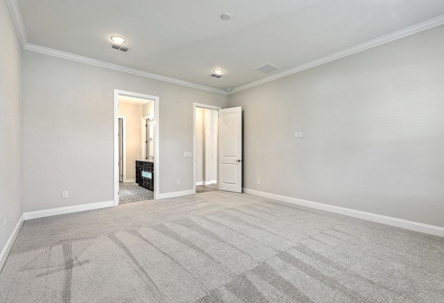 Spacious, unfurnished interior of a new home in K. Hovnanian's® Four Seasons at Lakes of Cane Bay, Summerville (Image 24).