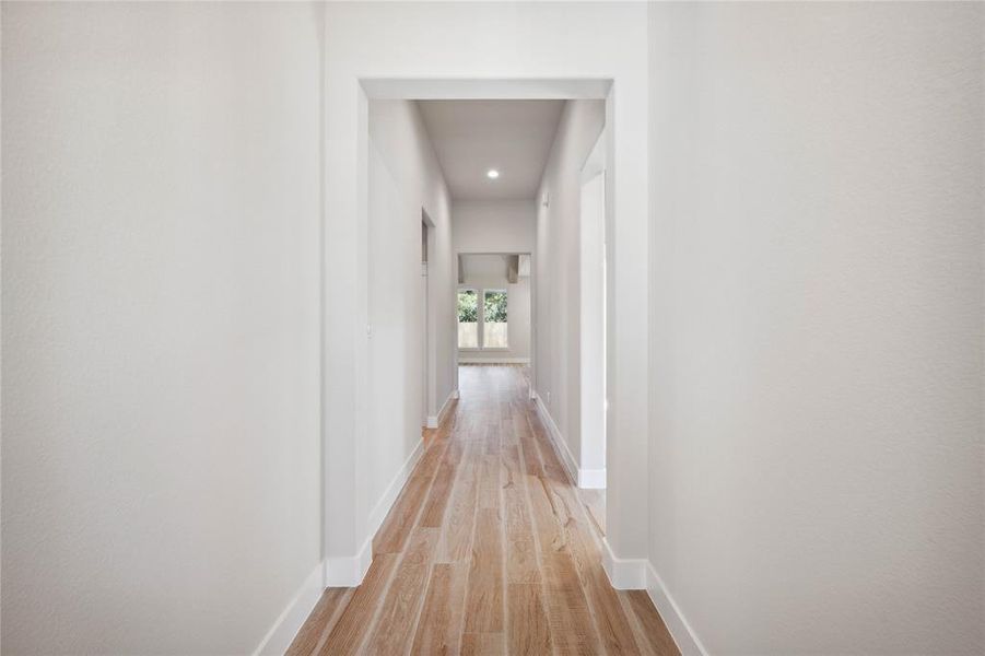 Corridor featuring light wood-type flooring