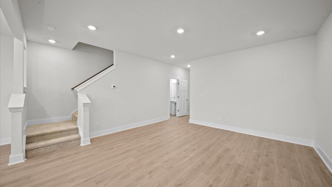 Exceptional family space with hardwood floors and seamless flow to dining and kitchen areas Exceptional family space with hardwood floors and seamless flow to dining and kitchen areas