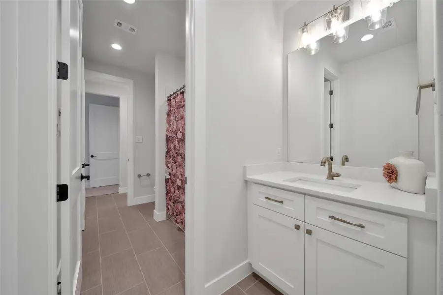 Furnished interior view inside a new home in ARTAVIA, Conroe (Image 48).