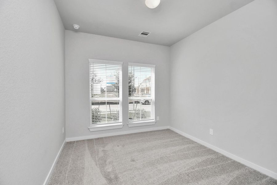 Generously sized secondary bedrooms featuring spacious closets, soft and inviting carpeting underfoot, large windows allowing plenty of natural light, and the added touch of privacy blinds for your personal retreat. Sample photo of completed home with similar floor plan. Actual colors and selections may vary. Generously sized secondary bedrooms featuring spacious closets, soft and inviting carpeting underfoot, large windows allowing plenty of natural light, and the added touch of privacy blinds for your personal retreat. Sample photo of completed home with similar floor plan. Actual colors and selections may vary.