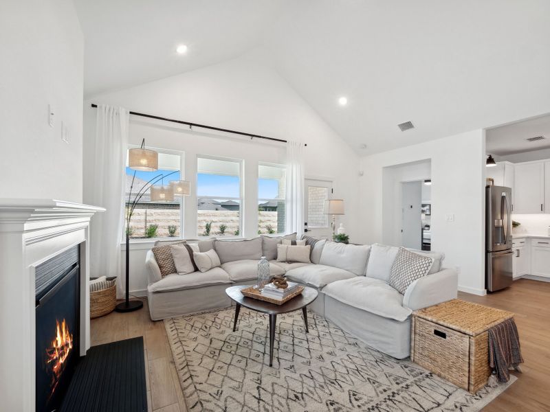 Great room with vaulted ceiling and fireplace Great room with vaulted ceiling and fireplace