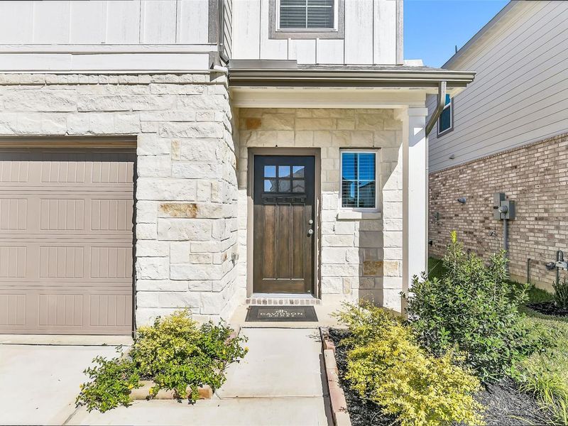 Exterior details and patio area of a home in Lakes at Black Oak, Magnolia (Image 2).