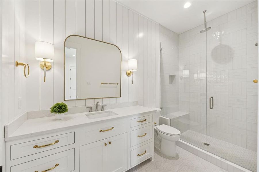 Downstairs bath with floor to ceiling tile, seamless glass shower. Downstairs bath with floor to ceiling tile, seamless glass shower.