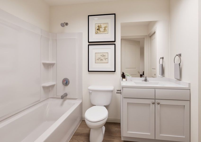 A clean bathroom featuring a toilet, sink, and shower, with neutral colors and bright lighting. A clean bathroom featuring a toilet, sink, and shower, with neutral colors and bright lighting.