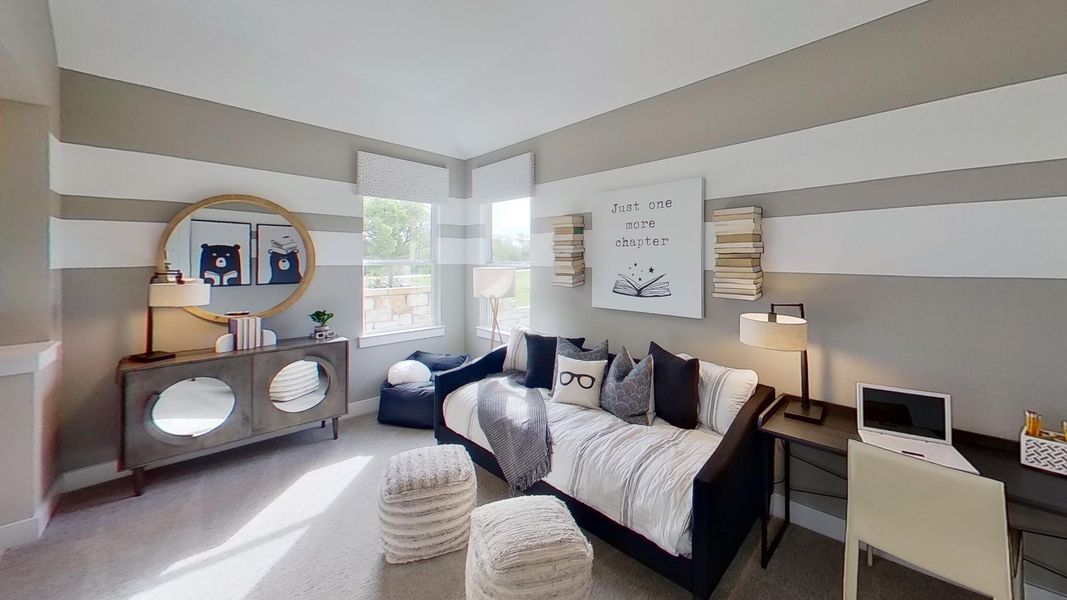 Bedroom with carpet and an office area