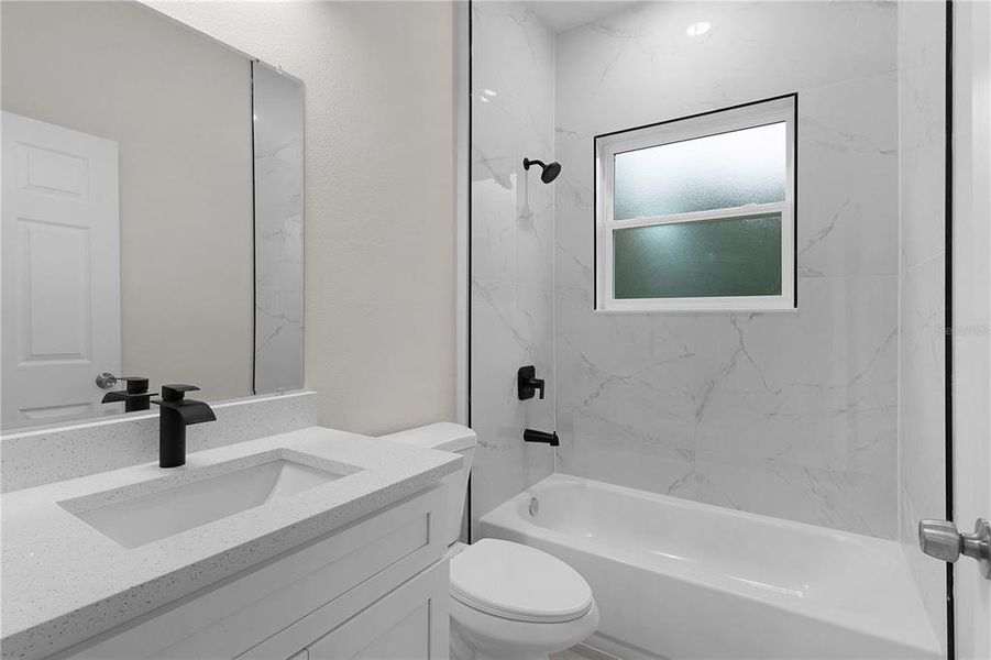 Guest bath with tiled tub surround